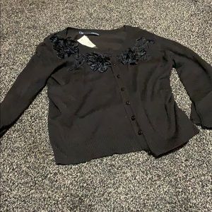 Brown cardigan with flower details on the neckline